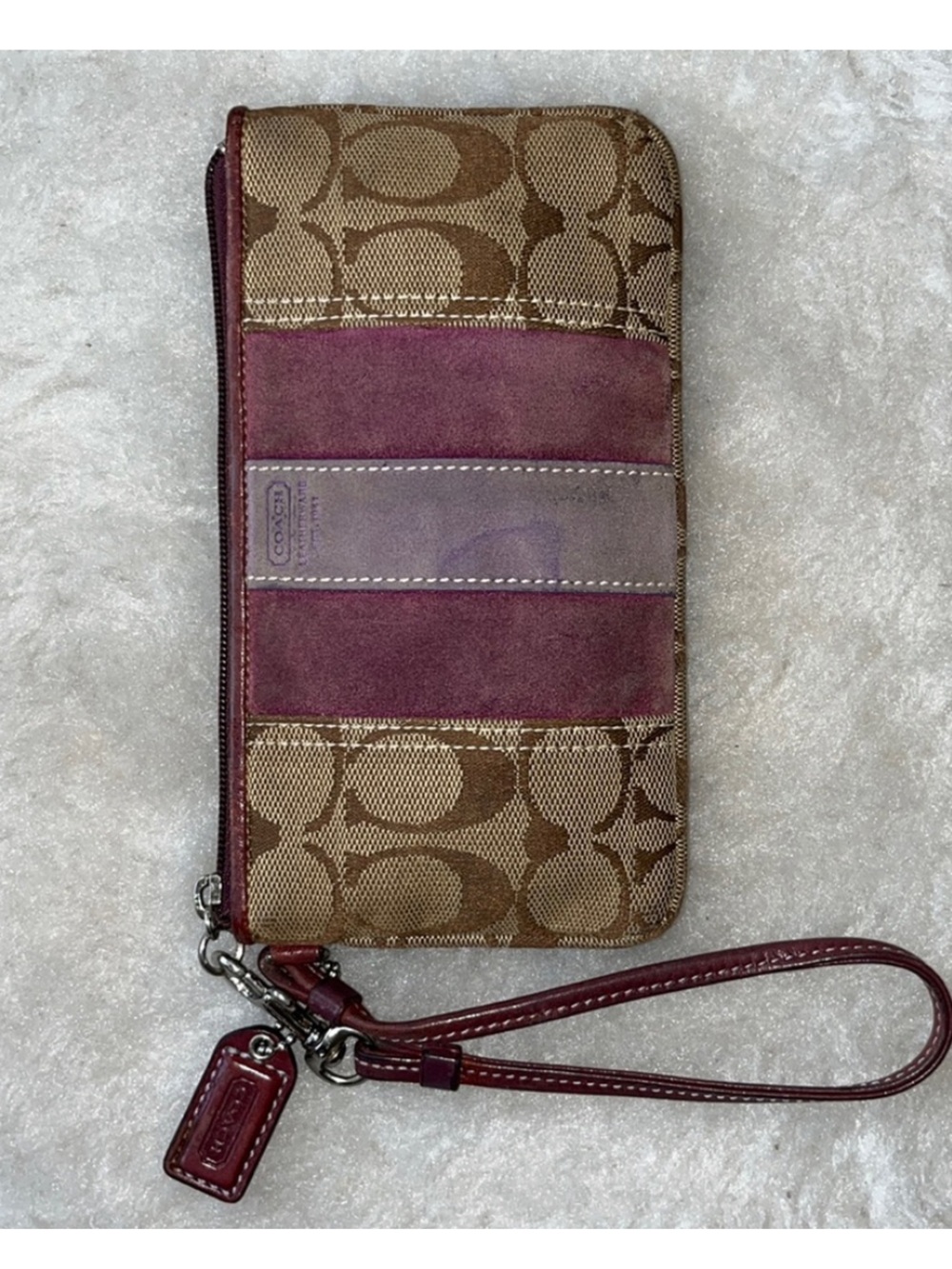 COACH tan signature fabric wristlet with mauve & lilac suede accents
